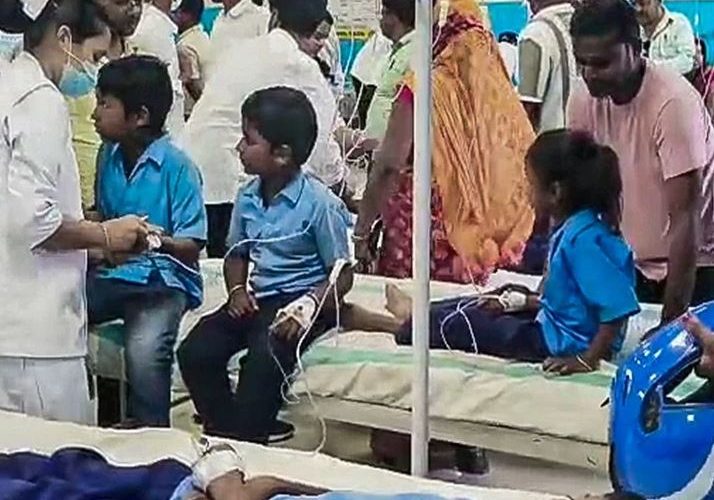 Parents and relatives gathered outside Bihar Sharif Model Hospital after children fell ill consuming contaminated mid-day meal in Nalanda