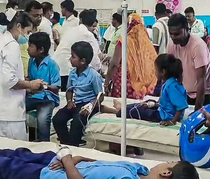 Parents and relatives gathered outside Bihar Sharif Model Hospital after children fell ill consuming contaminated mid-day meal in Nalanda