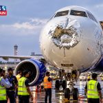 Airplane nose damage bird strike, IndiGo flight ground check, Indian airport aircraft engineering, dented airplane nose cone, passenger plane safety check