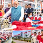 PM Narendra Modi interacting with women workers after inaugurating the Arvind Limited textile plant in Varanasi.